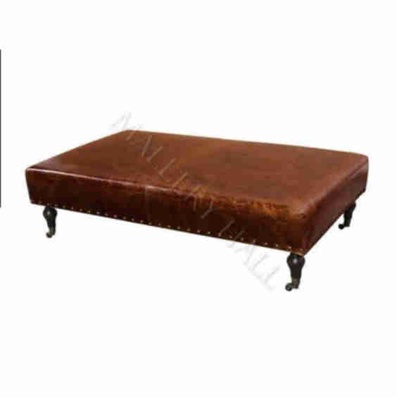 Wellington Leather Ottoman with Turned Castor Leg