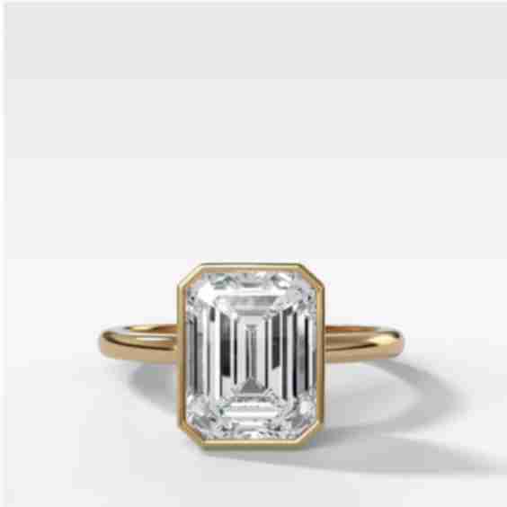 Club Ring Solitaire Engagement Ring with an Emerald Cut Diamond