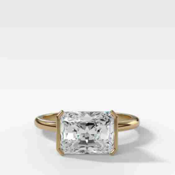 East West Half Bezel Solitaire Engagement Ring with Elongated Radiant Cut Diamond