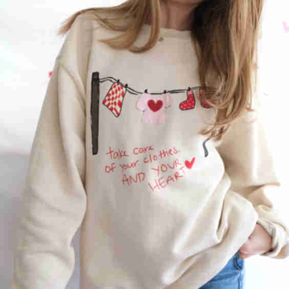 “Take Care” Clothesline Sweatshirt