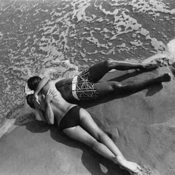 Models Embracing On A Beach Art Print