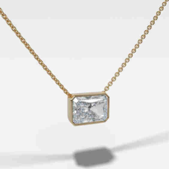Bezel Pendant Necklace With Elongated Radiant Cut Diamond